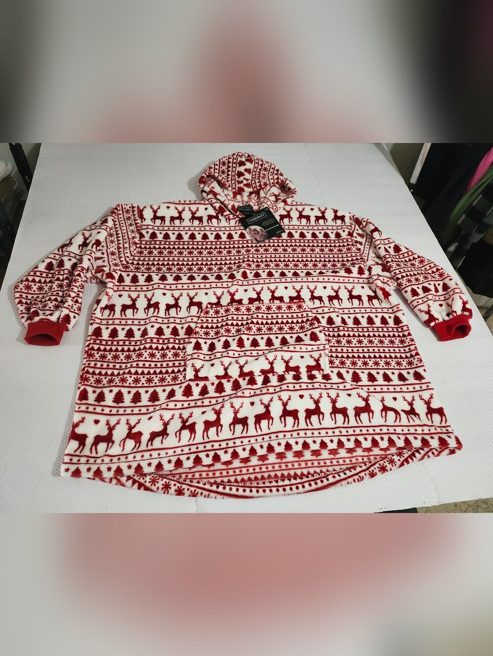 Throwzy wearable blanket hoodie features a red and white reindeer holiday patter - Picture 3 of 12